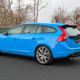 A photo of a blue Volvo V60 station wagon parked in a parking lot.